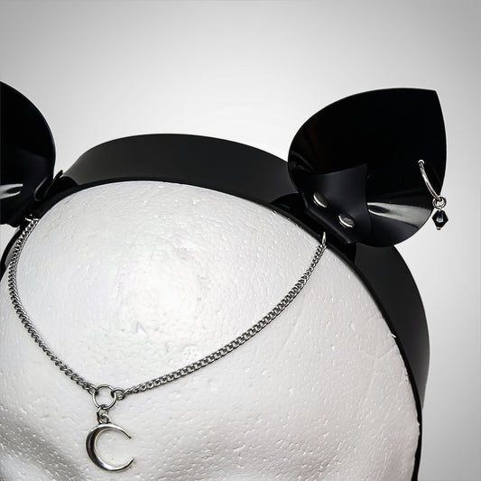 Gothic cat ear headband in an alternative style, featuring a dangling crescent moon charm and black crystal.