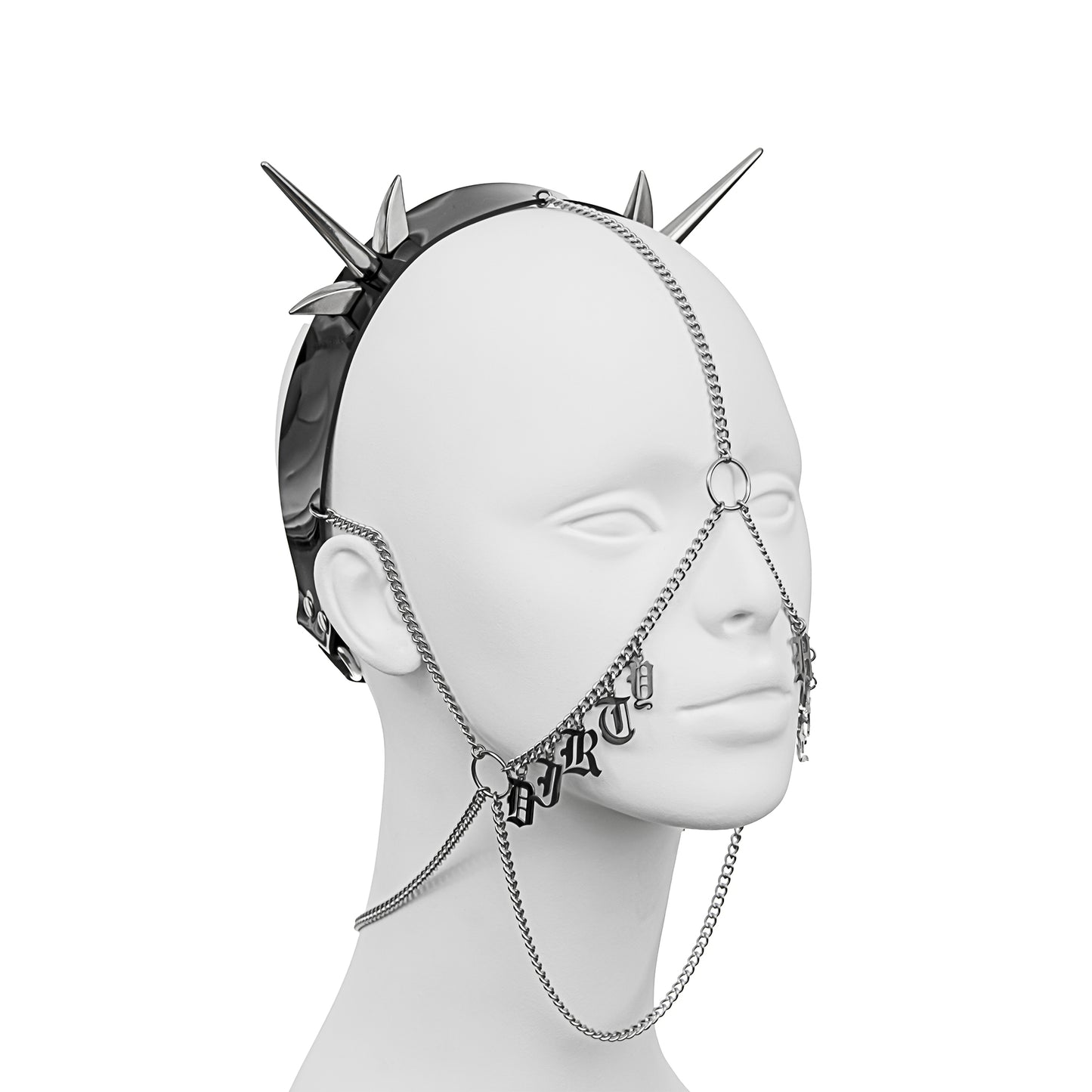 Gothic-style headpiece featuring a PVC headband, silver spikes, and draped face chains, with 'DIRTY' in stainless steel gothic lettering across the right cheek, part of 'DIRTY HABIT'.