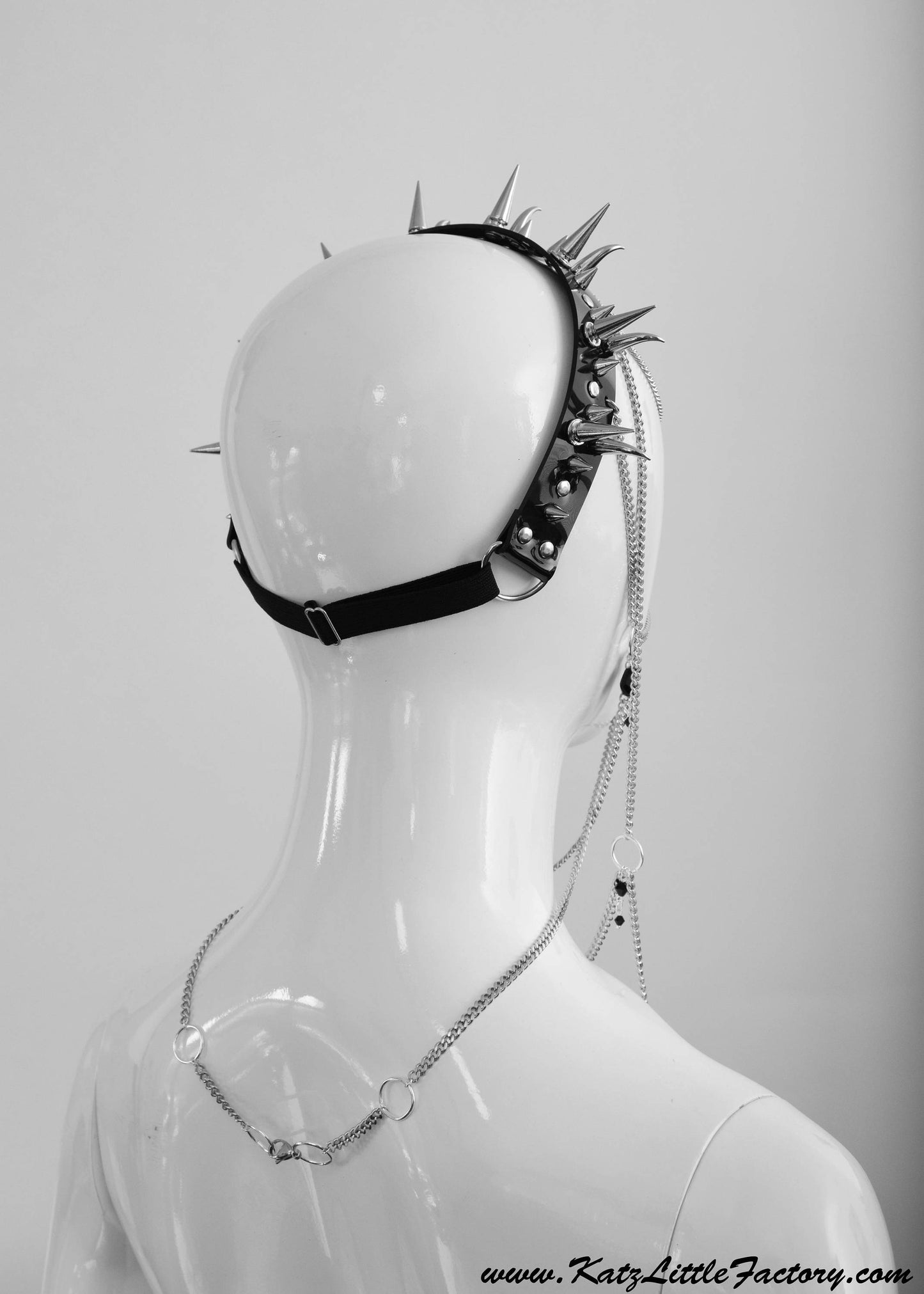 Back view of gothic headdress with a black PVC headband, with adjustable strap and stainless steel chain clasp.