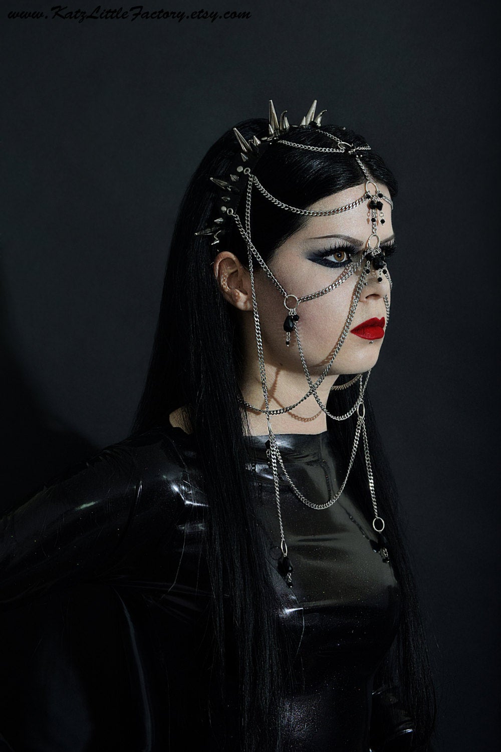 Kat modelling elaborate gothic headdress with a black PVC headband, clusters of spikes, and stainless steel chains and black glass beads face jewellery.