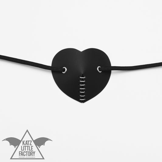 A black eye patch with jump rings