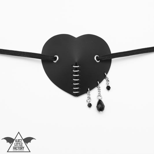 A Black eyepatch with droplets of beads