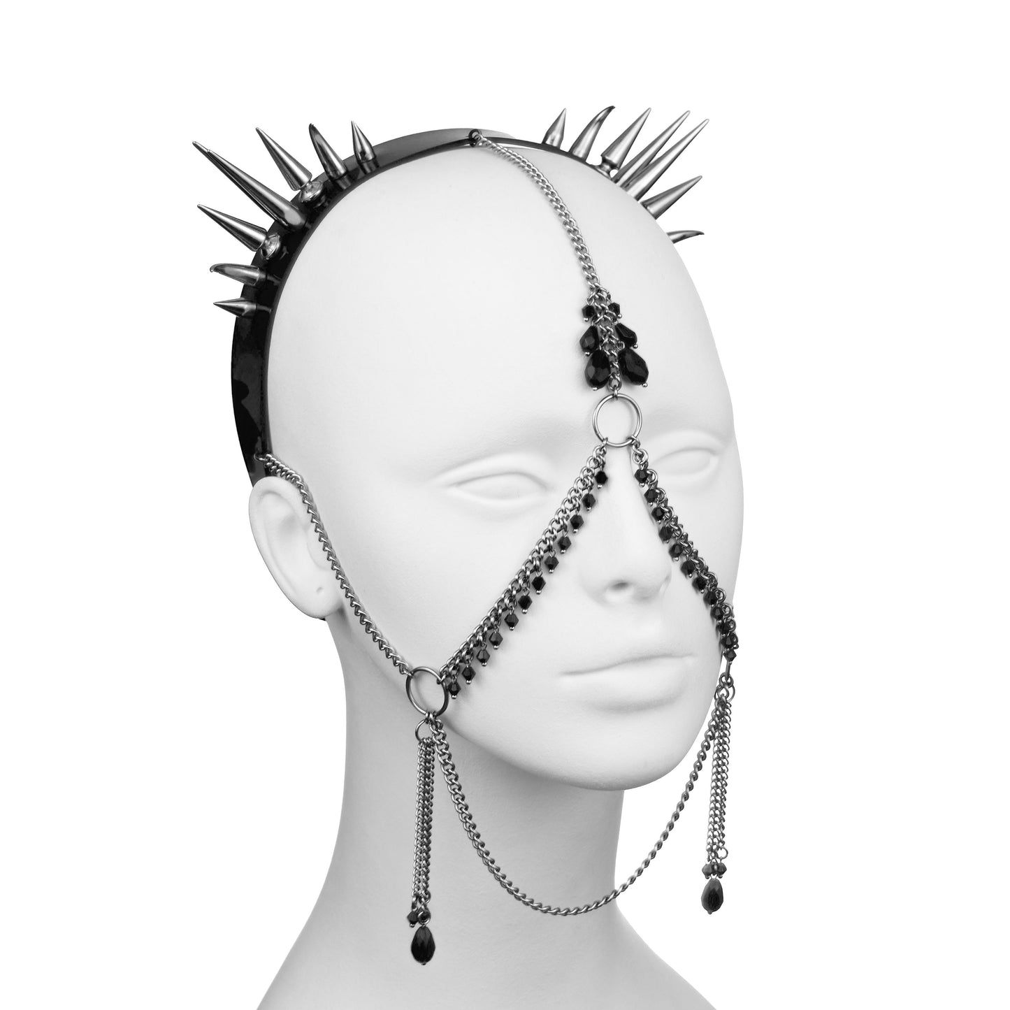 Spike headdress with chain face harness.