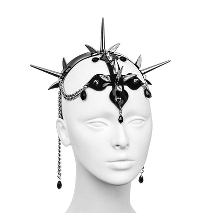 Elegant black PVC headdress featuring metallic spikes, an inverted cross, and elaborate chain detailing adorned with obsidian glass teardrops - a distinctive accessory for alternative couture.