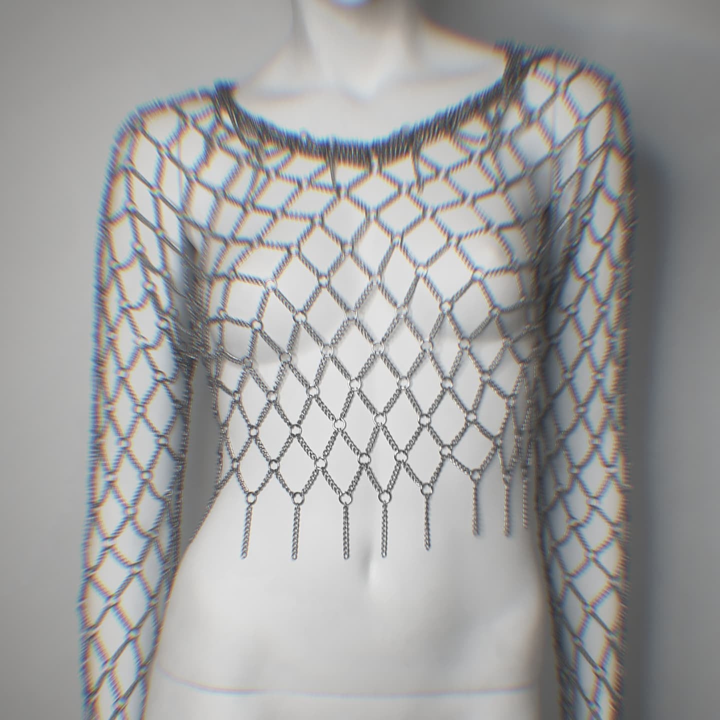 Mannequin wearing a fishnet metal top with long sleeves on a plain background