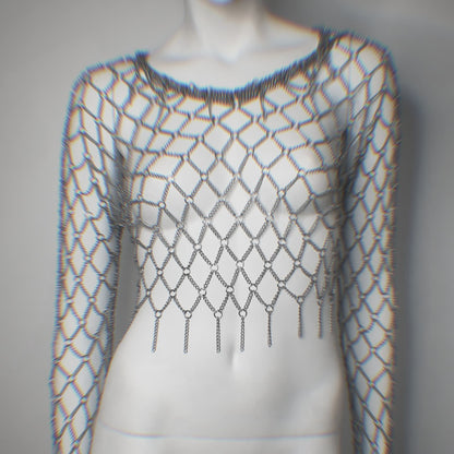 Mannequin wearing a fishnet metal top with long sleeves on a plain background
