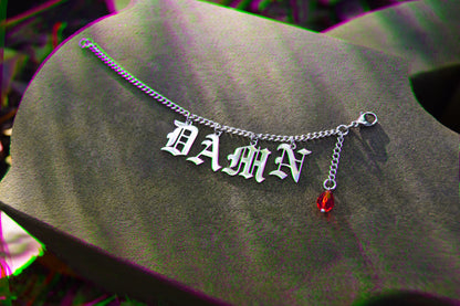 Custom nose to each jewerly with Gothic wording Damn with blood red droplet earring.