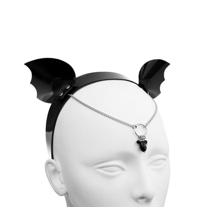 Demon wing costume headband with chain forehead jewelry.