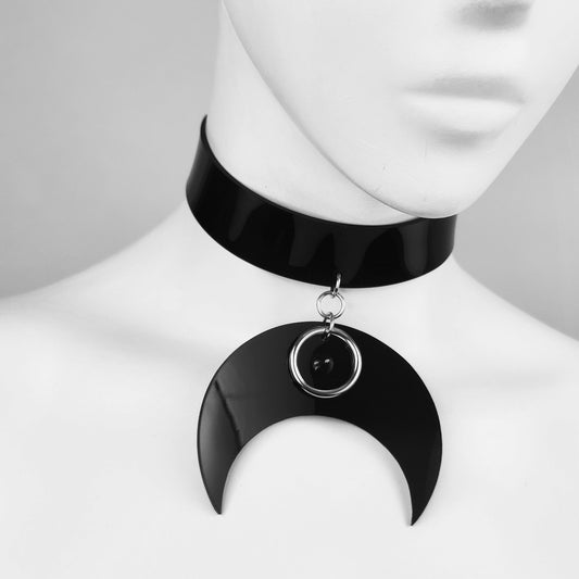 Black crescent moon pendant choker with spike and ring detail.