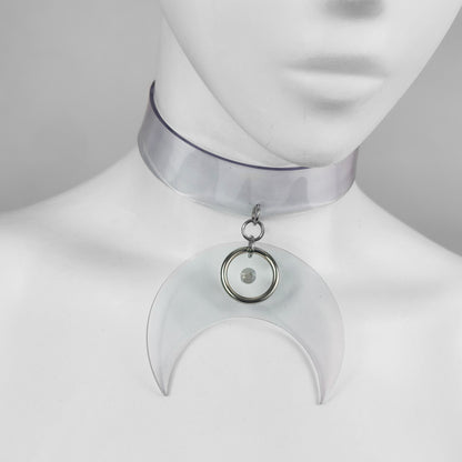 Translucent clear vinyl choker with large crescent moon pendant with metal ring and spike detail.