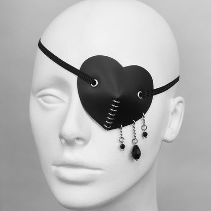 Black heart shape costume eye patch with black glass tear droplets.