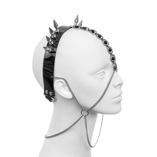 Gothic black PVC headpiece with silver bullet spikes, forehead-draping O-rings and dark glass beads, featuring face-framing silver chains - bold industrial fashion accessory with contemporary alternative style