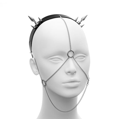 Minimalistic headdress with hints of bondage head harness. Front of the headpiece contains delicate chain harness attached to a black headband with spikes.