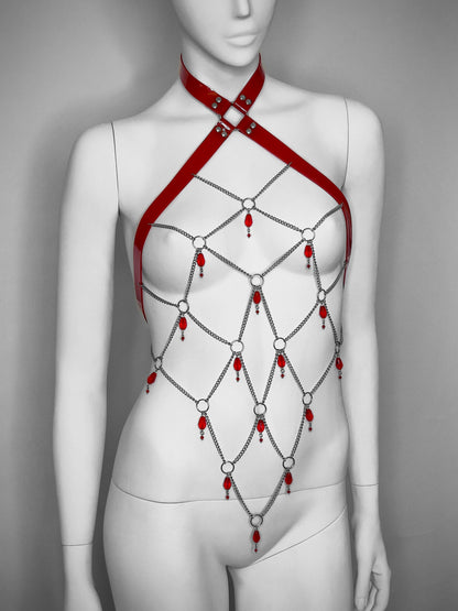 Red gothic PVC body harness with a network of stainless steel chain and  red glass beads. 