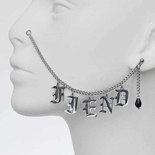 Nose to ear chain.  Face jewerly with Gothic lettering with black crystal earring.